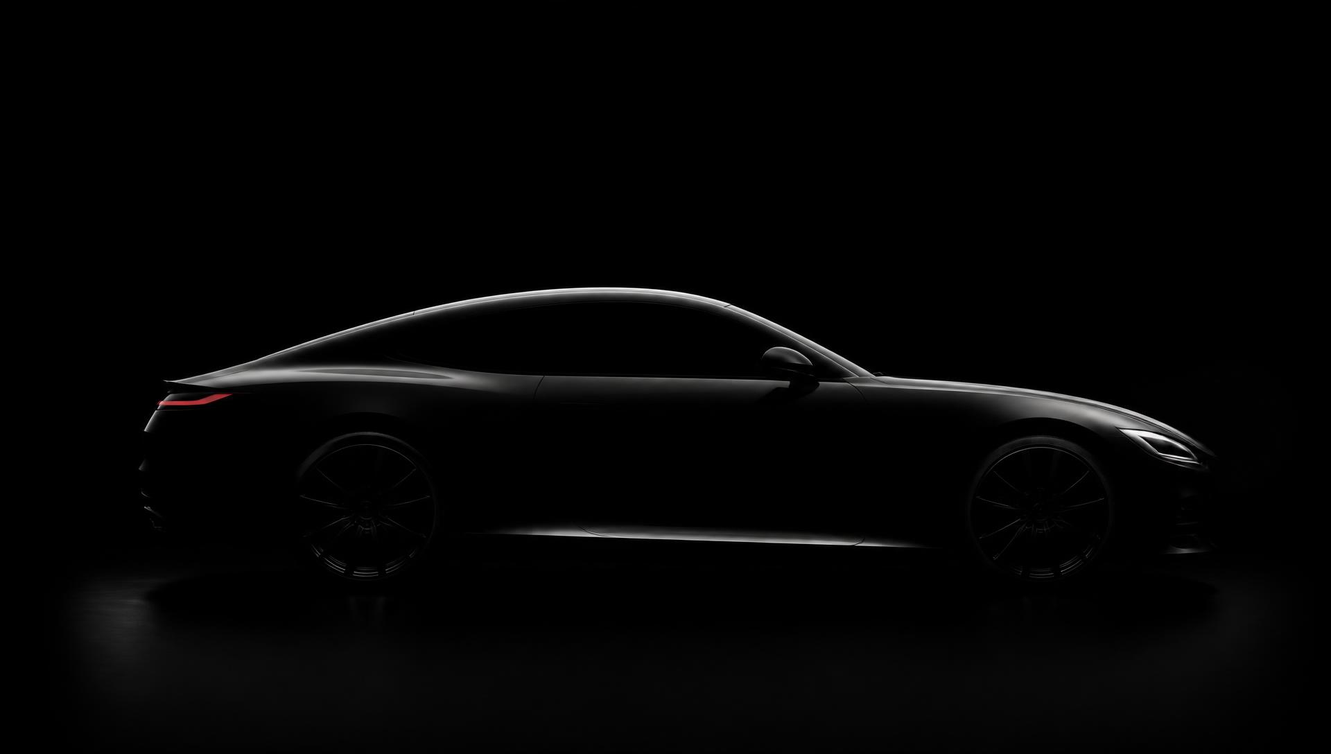 Sleek low-profile luxury coupe silhouette lit against a black background